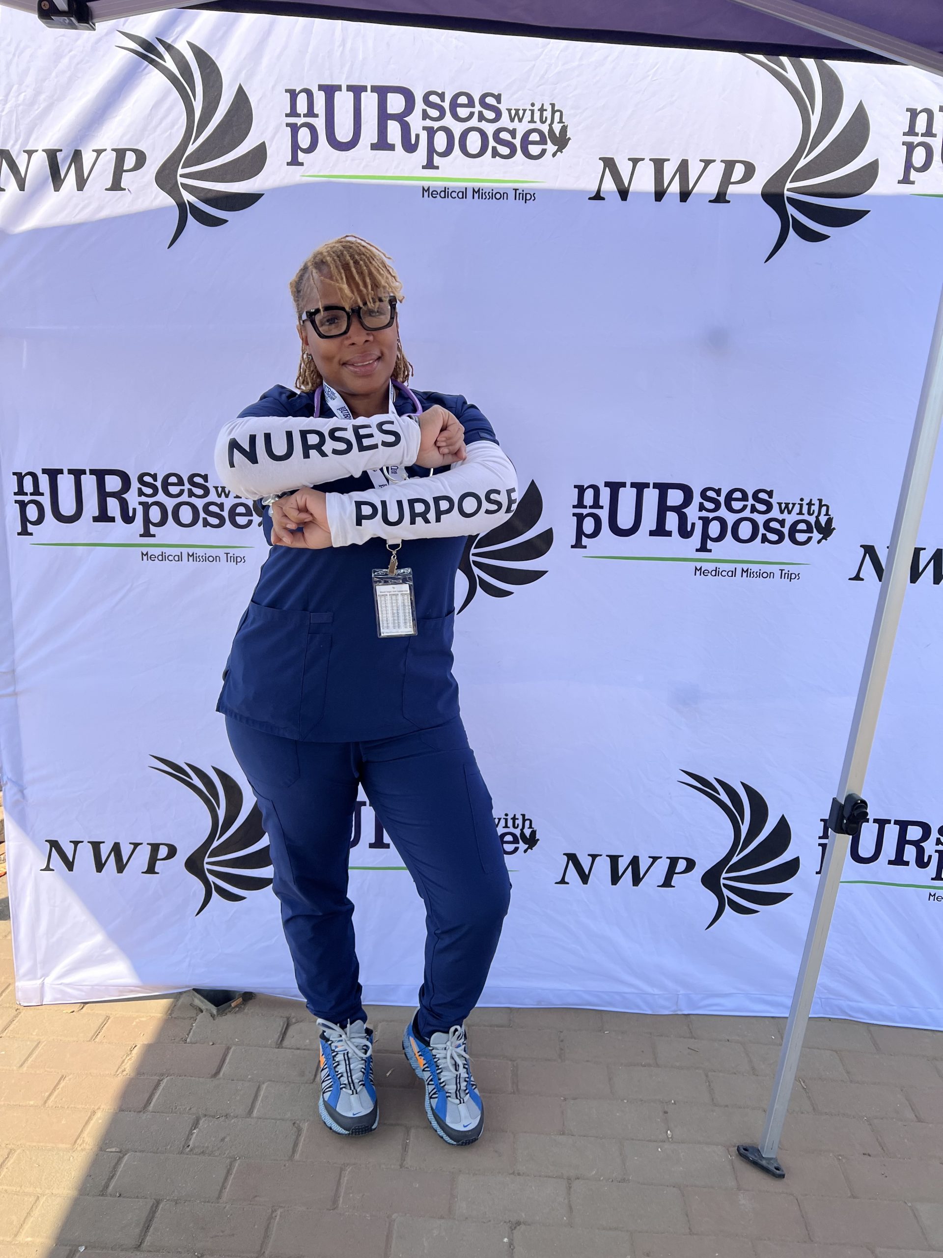 LaTasha Moore Cleveland Clinic nurse LaTasha Moore wearing scrubs at a Nurses With Purpose medical mission event