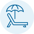 Beach chair and umbrella representing paid time off